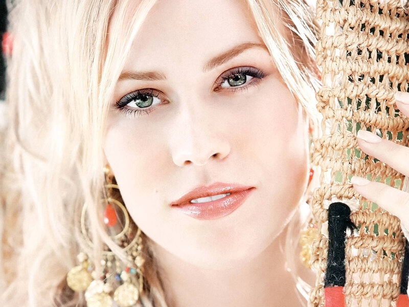 woman with blonde hair and green eyes