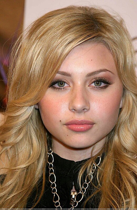 woman with blonde hair and green eyes