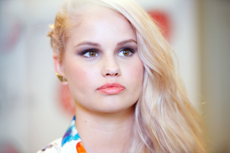 woman with blonde hair and makeup