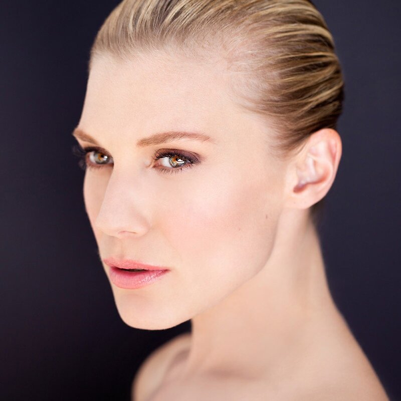 woman with blonde hair and makeup