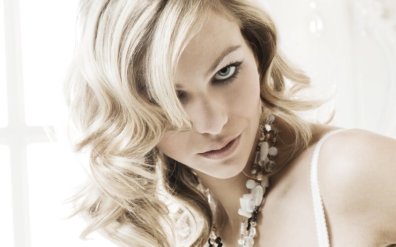 woman with blonde hair and necklace
