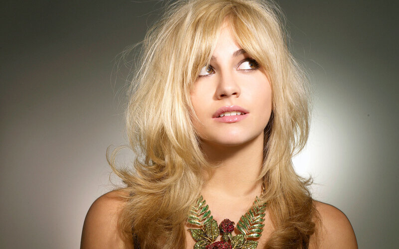 woman with blonde hair and necklace