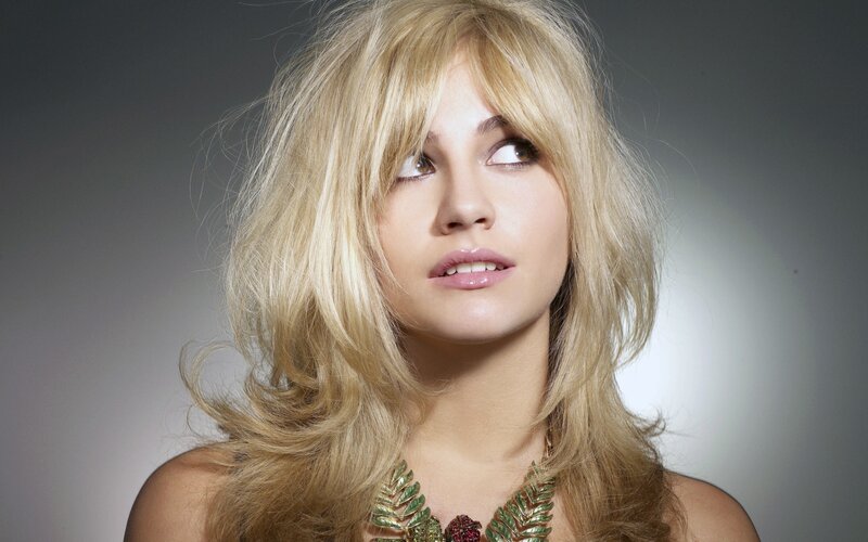 woman with blonde hair and necklace
