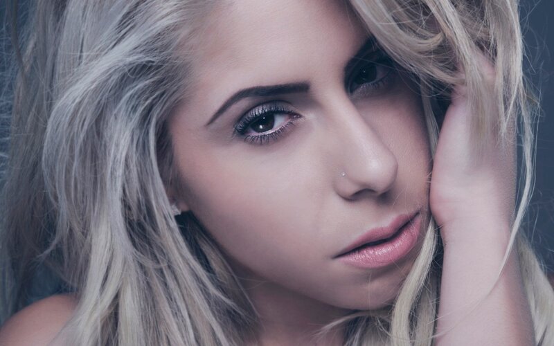 woman with blonde hair and nose piercing