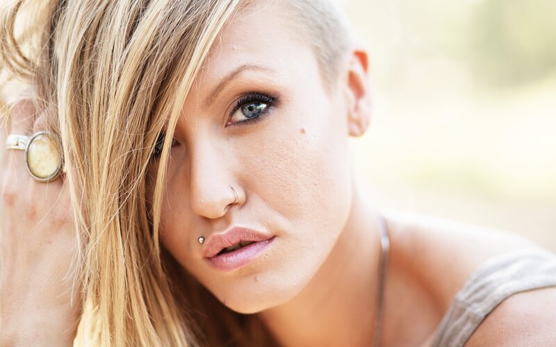 woman with blonde hair and piercings