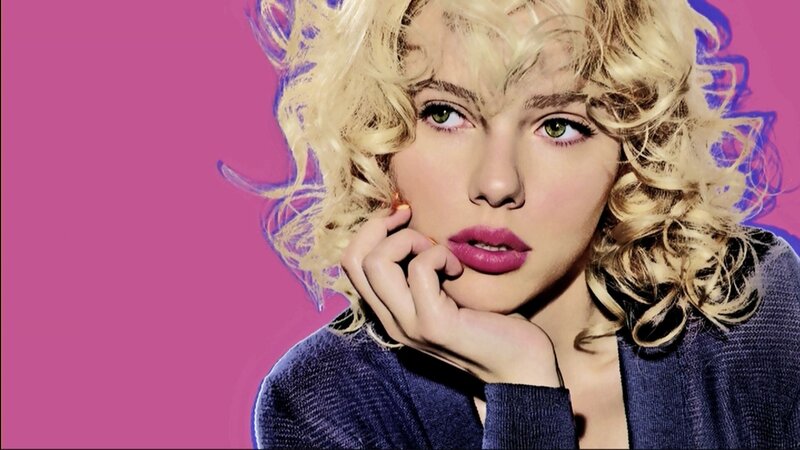 woman with blonde hair and pink background