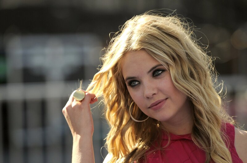 woman with blonde hair and pink top