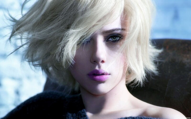 woman with blonde hair and purple lips