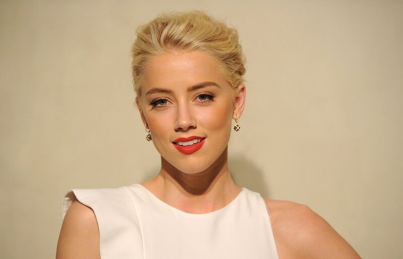 woman with blonde hair and red lipstick