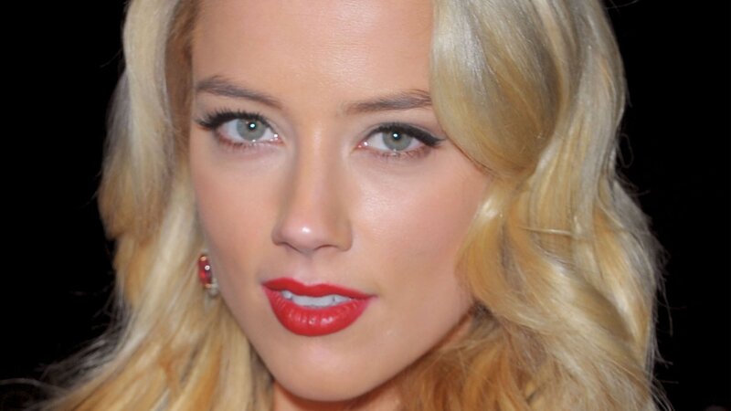 woman with blonde hair and red lipstick