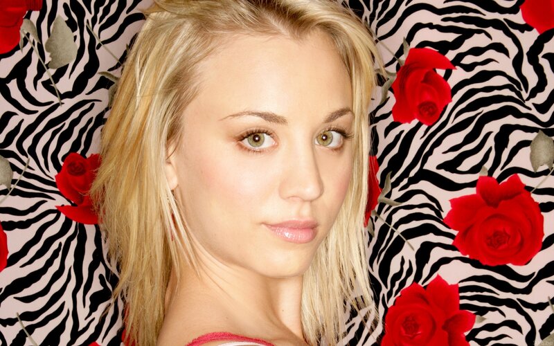 woman with blonde hair and red roses