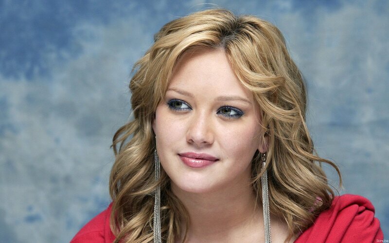 woman with blonde hair and red top