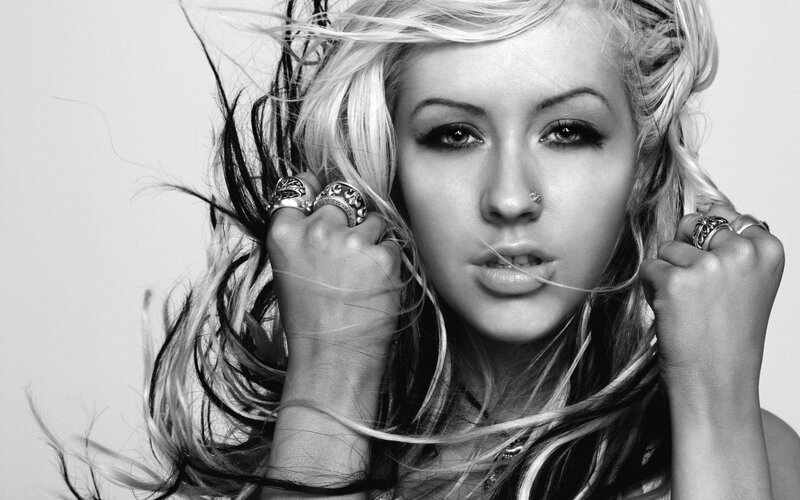 woman with blonde hair and rings