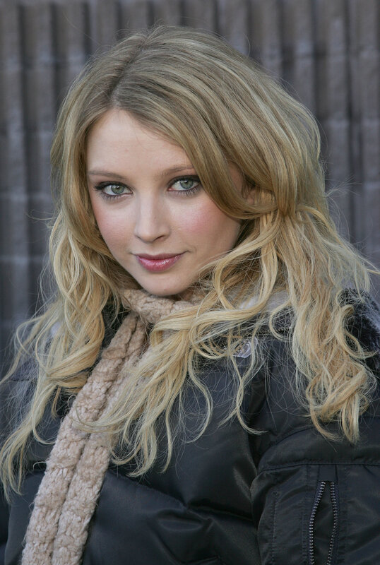 woman with blonde hair and scarf