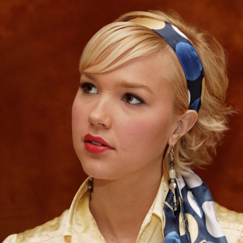 woman with blonde hair and scarf