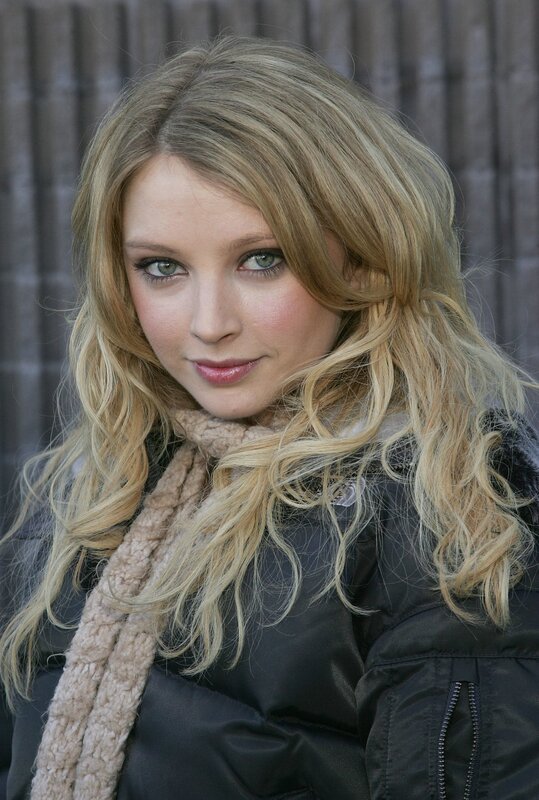 woman with blonde hair and scarf