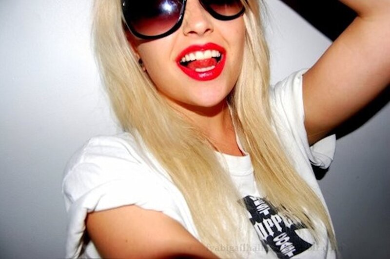 woman with blonde hair and sunglasses