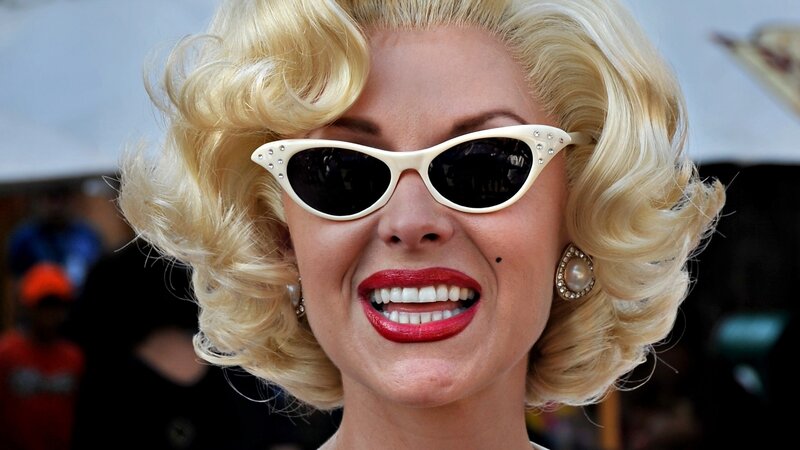 woman with blonde hair and sunglasses