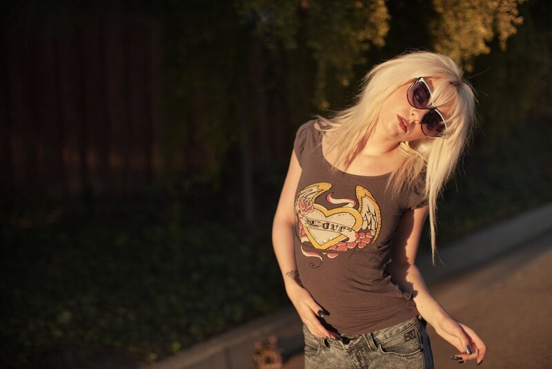 woman with blonde hair and sunglasses