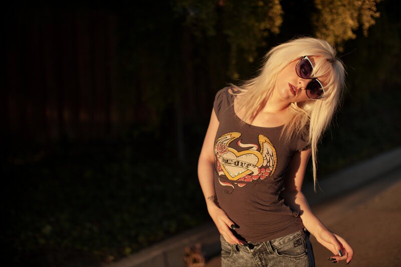 woman with blonde hair and sunglasses