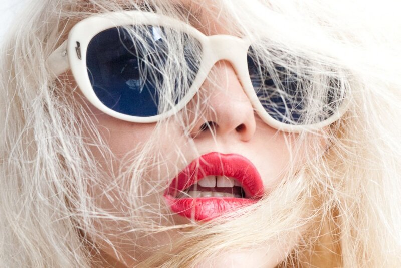 woman with blonde hair and sunglasses