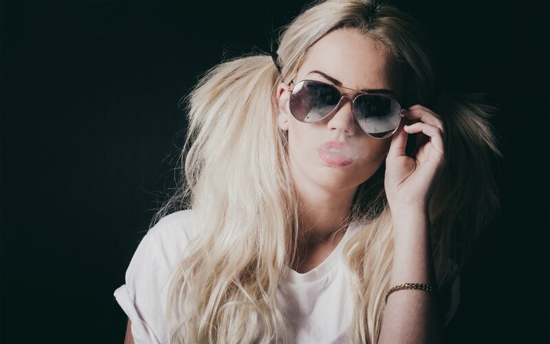 woman with blonde hair and sunglasses