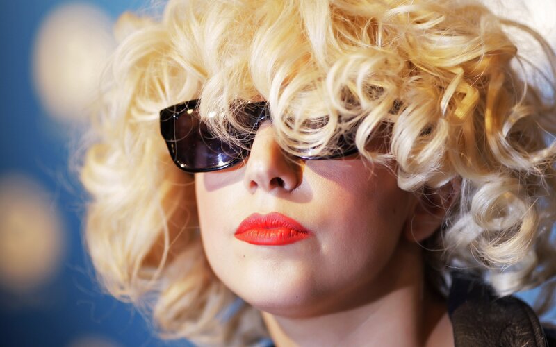 woman with blonde hair and sunglasses