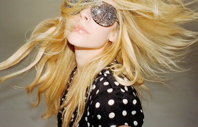 woman with blonde hair and sunglasses