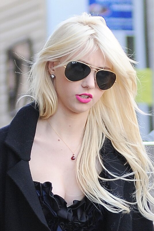 woman with blonde hair and sunglasses