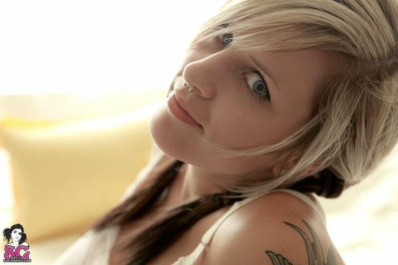 woman with blonde hair and tattoo