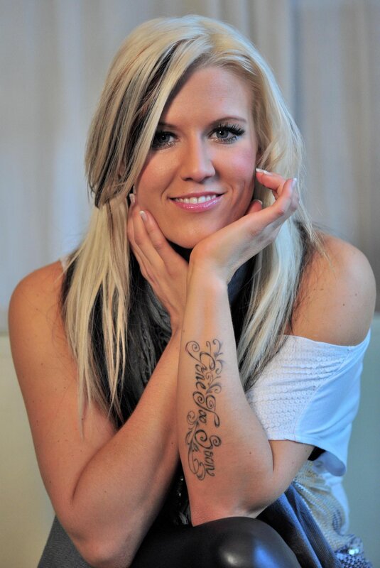 woman with blonde hair and tattoo
