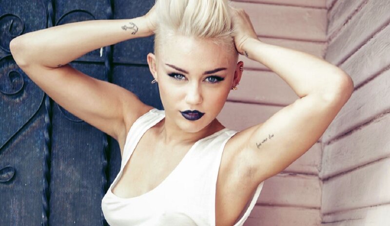 woman with blonde hair and tattoos