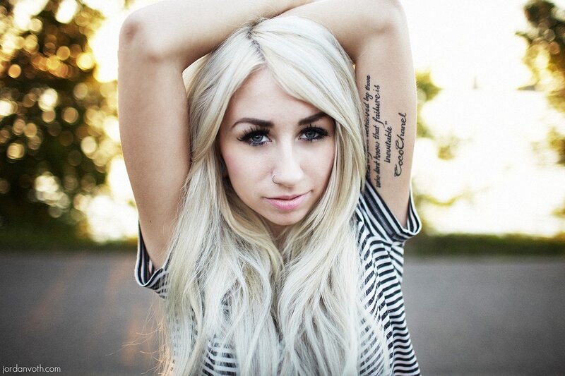 woman with blonde hair and tattoos
