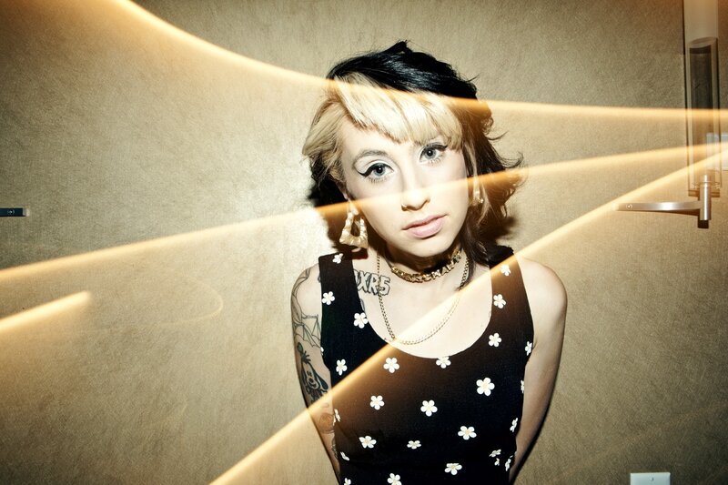 woman with blonde hair and tattoos
