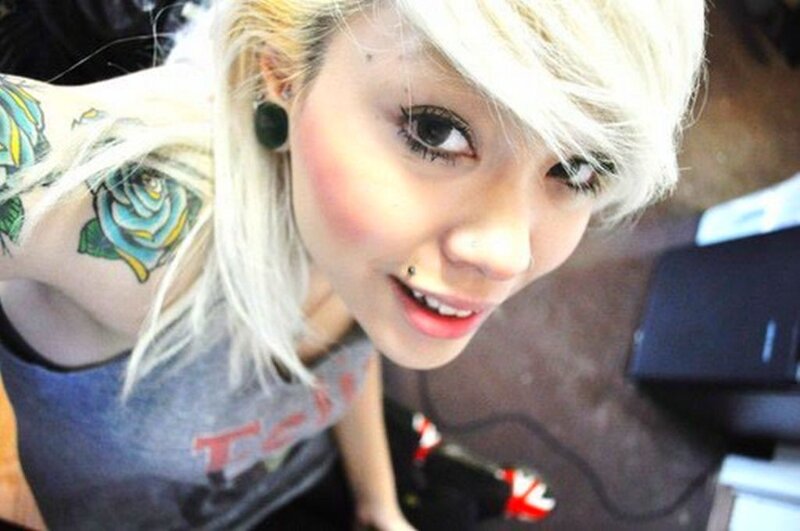 woman with blonde hair and tattoos