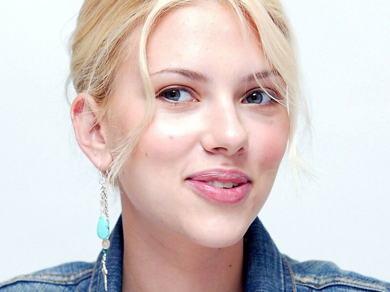 woman with blonde hair and turquoise earring