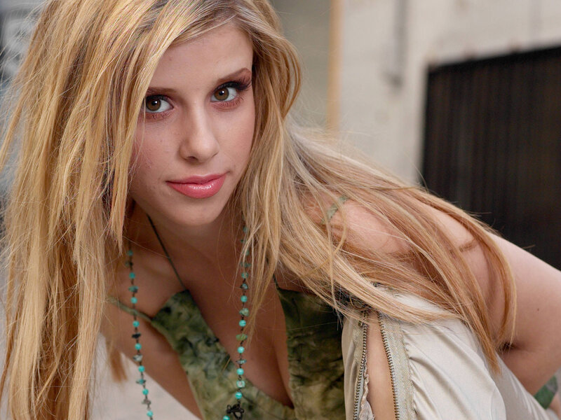 woman with blonde hair and turquoise necklace