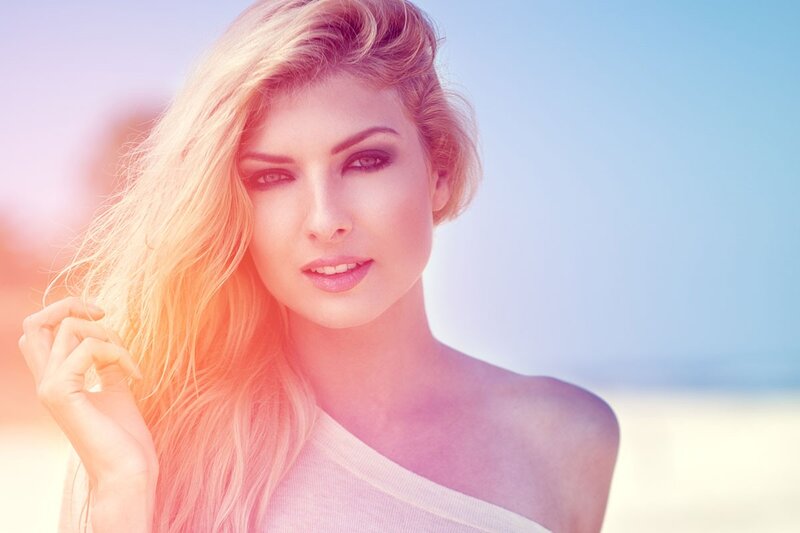 woman with blonde hair at beach