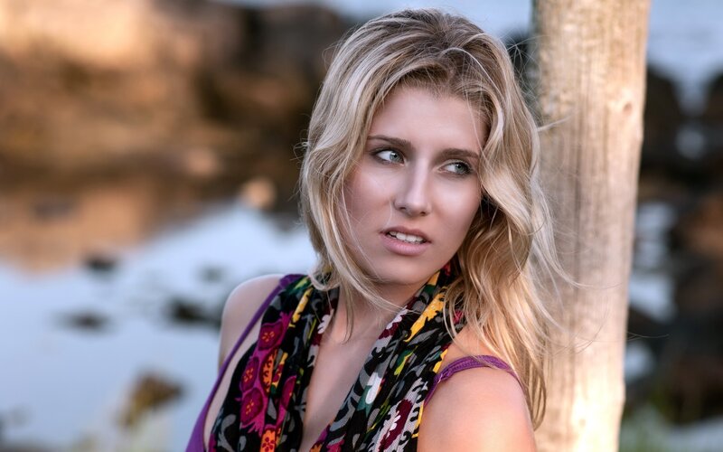 woman with blonde hair at beach