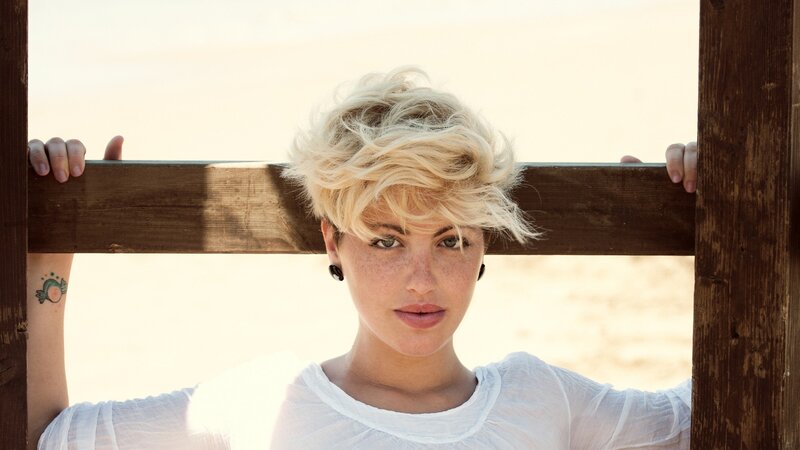woman with blonde hair at beach