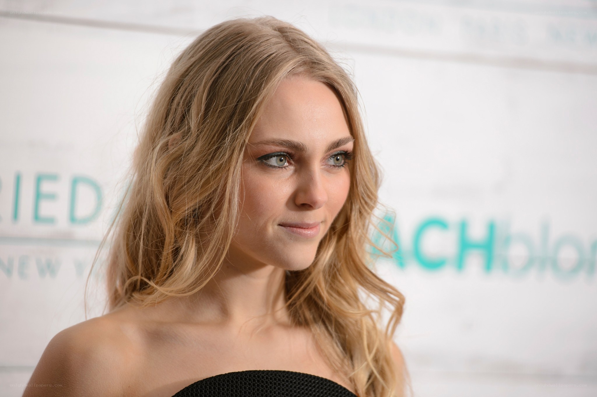 woman with blonde hair at event