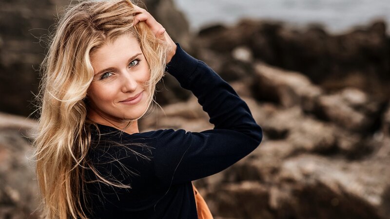 woman with blonde hair at the beach
