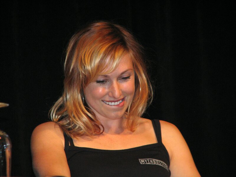 Woman with Blonde Hair — Black, Happy, Photograph, Black Top, Earring