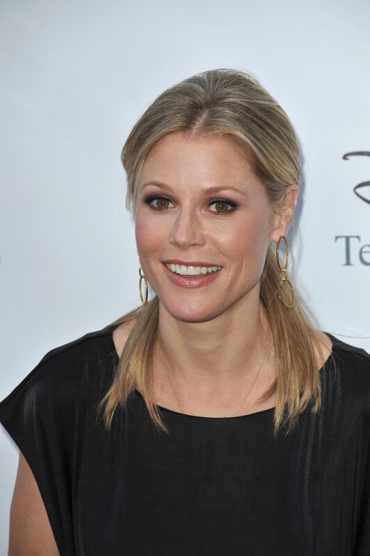 Woman with Blonde Hair — Black, Smiling, Photograph, Black Top, Gold Earrings