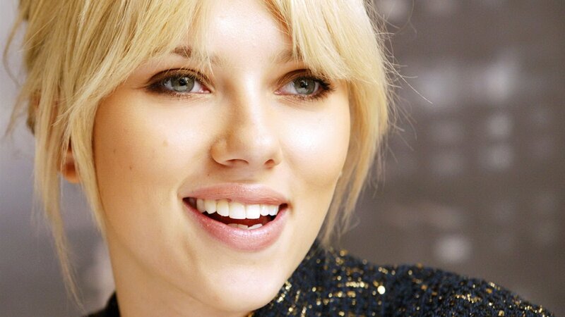 Woman with Blonde Hair — Black, Smiling, Photograph, Blonde Hair, Green Eyes