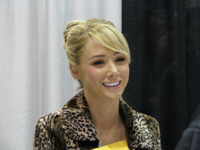 Woman with Blonde Hair — Black, Smiling, Photograph, Leopard Print Jacket