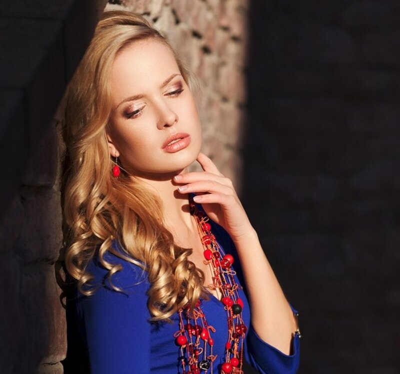 Woman with Blonde Hair — Blue, Dramatic, Afternoon, Photograph, Red Necklace