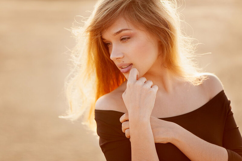 Woman with Blonde Hair — Brown, Contemplative, Sunset