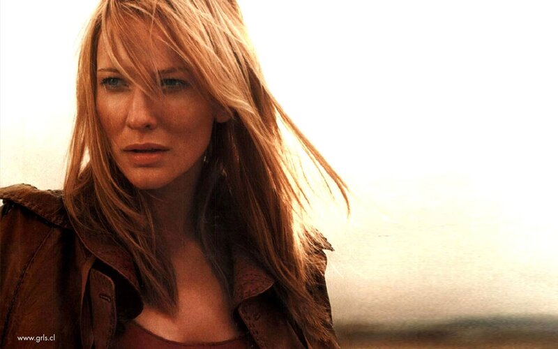 Woman with Blonde Hair — Brown, Dramatic, Photograph, Brown Jacket