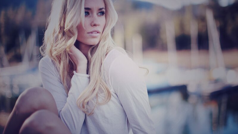 woman with blonde hair by the water